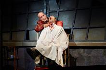 Tom Ford (left, as Sweeney Todd) dispatches another victim, actor Alex Syiek (right)